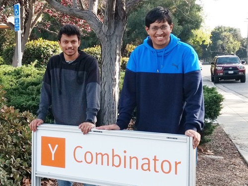 Sarthak Jain and Prathamesh Juvatkar behind the Y Combinator sign, winter 2017