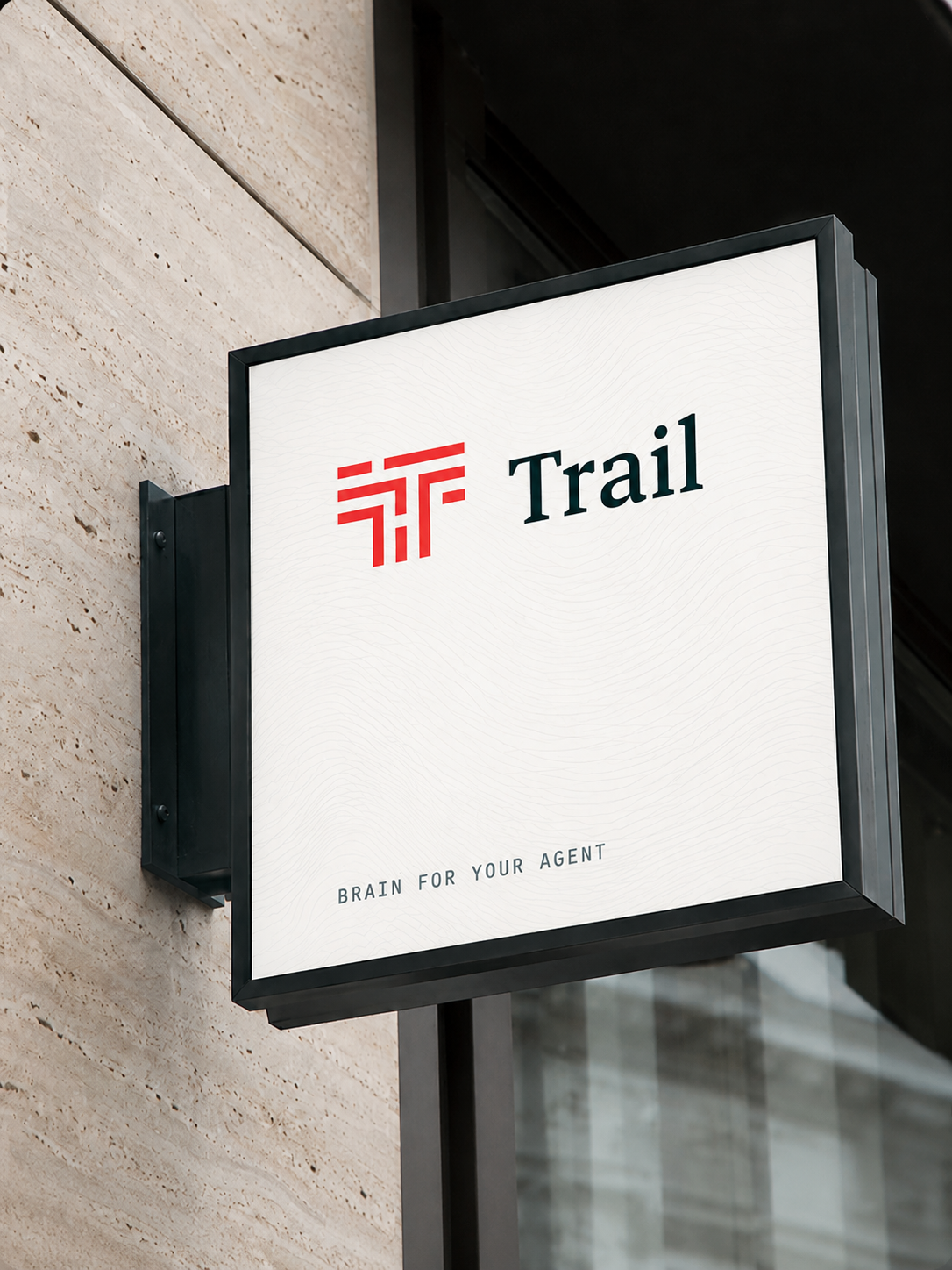A Trail blade sign on a stone facade